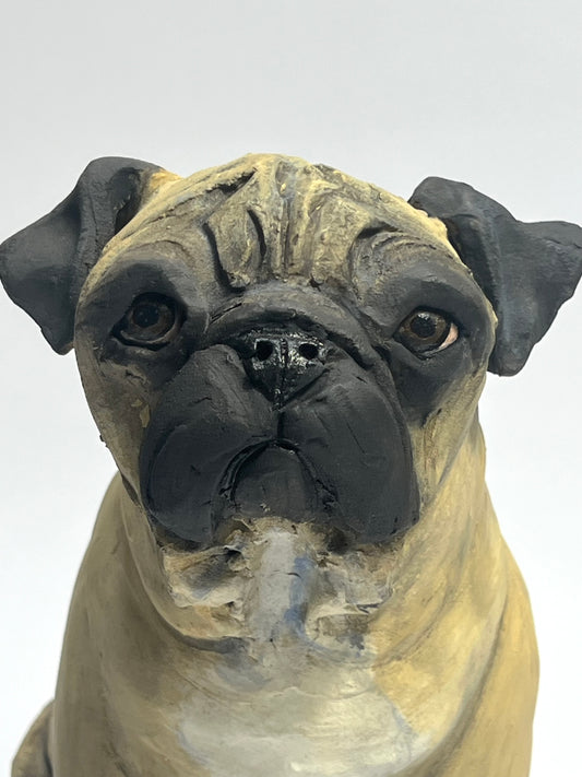 Ceramic pug sculpture by Olivia Brown